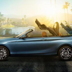 A closer look at the mechanical convertible design of the BMW 230i Convertible in Seaside Blue Metallic.