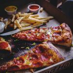 baked pepperoni pizza with French fries Photo by Eiliv-Sonas Aceron on Unsplash 