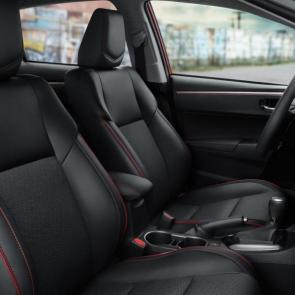 Corolla Special Edition Black mixed-media interior shown with red contrast accents.