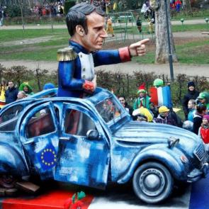  A float at the Rose Monday carnival parade in in Mainz depicts French President Emmanuel Macron as a Napoleonic figure in a dilapidated 2CV decorated with an EU flag Ralph Orlowski/Reuters 