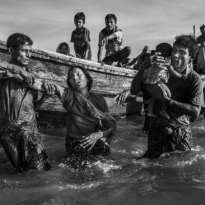 Rohingya Refugees Flee Into Bangladesh to Escape Ethnic Cleansing by Kevin Frayer, Getty Images. Nominee, General news stories. Clearance operations’ against Rohingya Muslims in Myanmar conducted by the Burmese army led to hundreds of thousands of refugees fleeing into Bangladesh on foot or by boat. Many died in the attempt. In Bangladesh, refugees were housed in makeshift settlements.