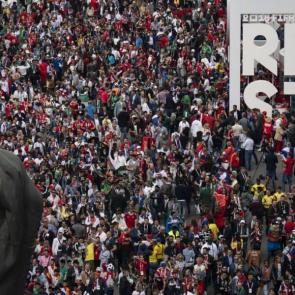 Fans stream past the statue of Lenin as they make their way into Luzhniki stadium.

Photograph: Felipe Dana/AP