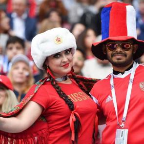 Russia fans pose as they wait for the start of the Russia 2018 World Cup Group A football match between Russia and Saudi Arabia at the Luzhniki Stadium in Moscow on June 14, 2018/AFP