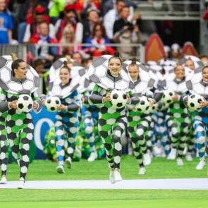 Performers take to the pitch.
Photograph: Sergei Bobylev/TASS/Getty Images