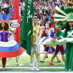 Artists wear the colours of Russia and Saudi Arabia, the two teams who will compete in the opening match.
Photograph: Patrik Stollarz/AFP/Getty Images