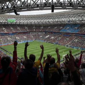 Fans cheer as the game – and tournament – gets underway
Photograph: Felipe Dana/AP