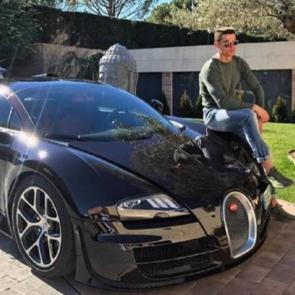 Cristiano Ronaldo Sitting On A Bugatti veyron