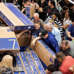 This was the scene in a shop where people were desperate to get their hands on a cheap TV in Sao Paulo, Brazil (Picture: EPA)