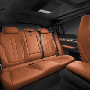 The rear interior of the BMW X6 M in Aragon Brown Full Merino Leather