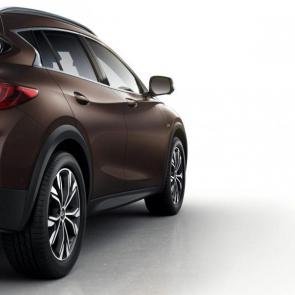2019 INFINITI QX30 Crossover Exterior | Passenger’s side view in Chestnut Bronze, featuring side sills and wheel well trim