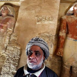 An archaeological worker stands inside the tomb. (Mohamed Abd El Ghany/Reuters)