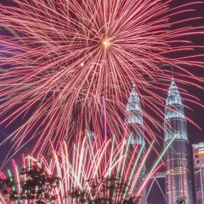 New Year fireworks are seen near the Petronas Twin Towers in Kuala Lumpur, Malaysia
