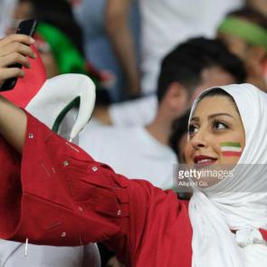 DUBAI, UNITED ARAB EMIRATES - JANUARY 16: Iranian fan takes a selfie during the AFC Asian Cup Group D