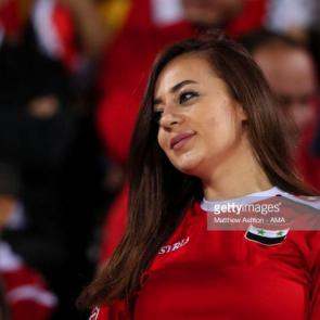 SHARJAH, UNITED ARAB EMIRATES - JANUARY 06: A female fan of Syria looks on during the AFC Asian Cup Group B