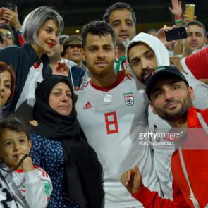 ABU DHABI, UNITED ARAB EMIRATES - JANUARY 20: Morteza Pouraliganji of Iran celebrates with the fans after victory during the AFC Asian Cup