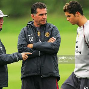 MANCHESTER, ENGLAND - AUGUST 24: Sir Alex Ferguson of Manchester United (L) and assistant manager Carlos Queiroz (C) talk to Cristiano Ronaldo during a first team training session ahead of the Champions League qualifying match against Dinamo Bucharest at Carrington Training Ground on August 24, 2004 in Manchester, England. (Photo by John Peters/Manchester United via Getty Images)