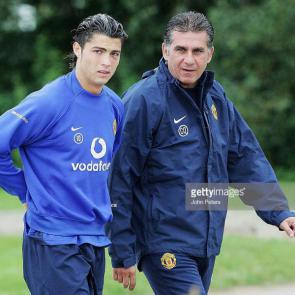 MANCHESTER, ENGLAND - SEPTEMBER 26: Cristiano Ronaldo and Carlos Queiroz of Manchester United look on during a first team training session at Carrington Training Ground on 26 September 2005, in Manchester, England. (Photo by John Peters/Manchester United via Getty Images)