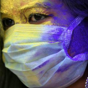 An Indian college student wears a face mask as a precautionary measure against the COVID-19 coronavirus as she attends Holi festival celebrations in Bhopal, India.

Sanjeev Gupta/EPA-EFE/Shutterstock