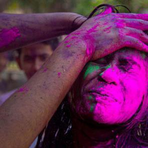 Gauhati, India: Revelers smear colored powder on a girl during Holi celebrations.

Anupam Nath/AP