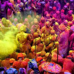 Mathura, India: Hindu devotees play with colorful powders at the Radharani Temple of Nandgaon.

Avishek Das/SOPA Images/Shutterstock