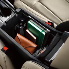 Front armrest with large capacity storage compartment